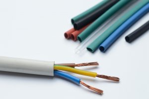 Heat shrink tubing protecting three-core stripped wire